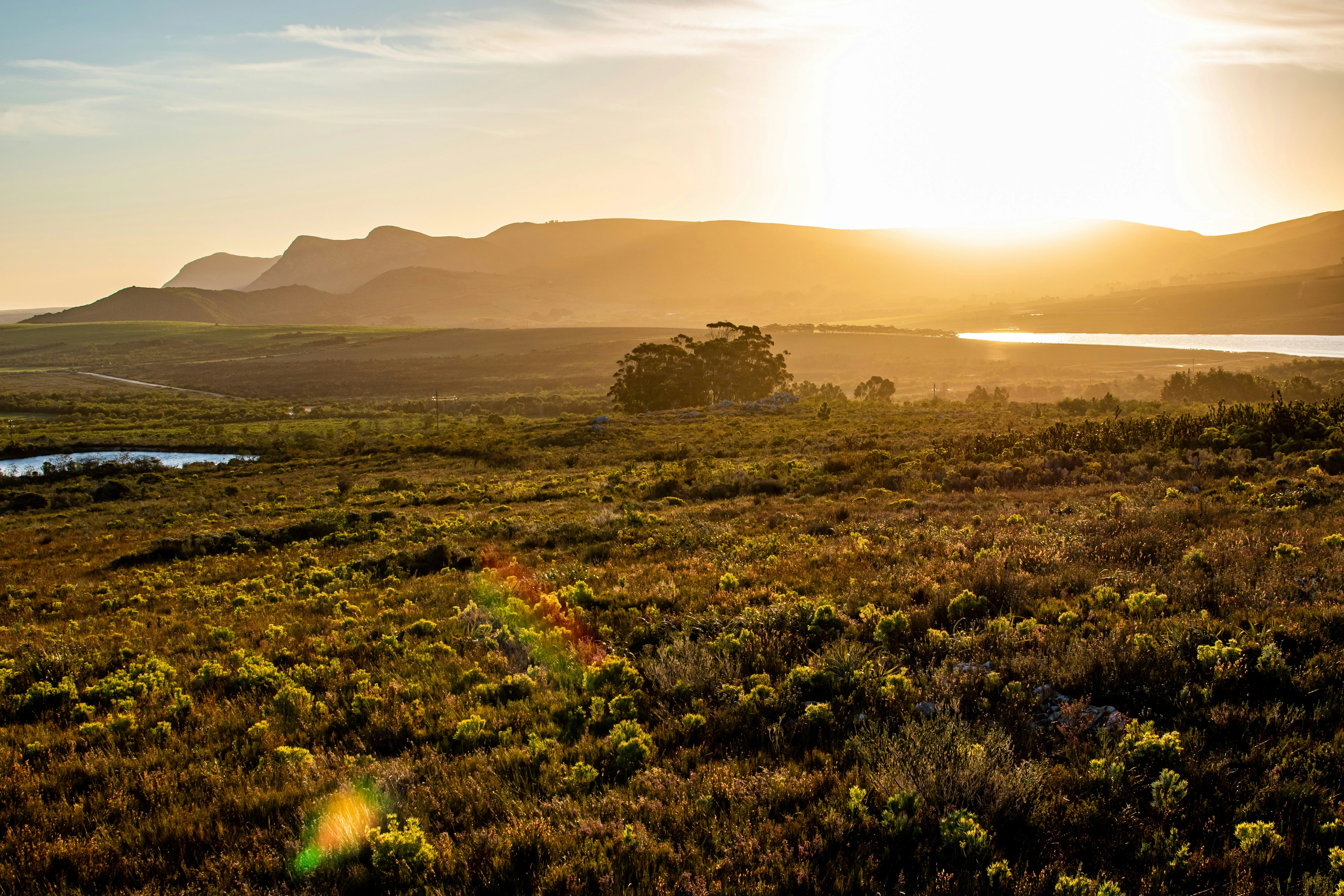 Kloof & Klip, exterior at sunset, looking across the kloof to the sea